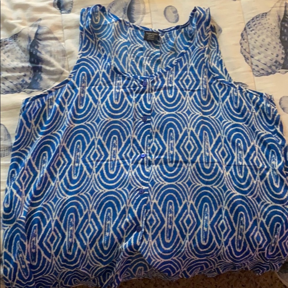 Blue shirt with white designs